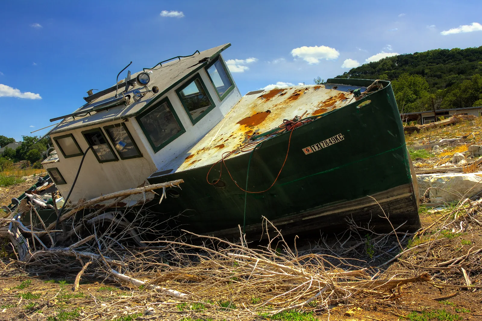 A boat left high and dry in an arm of Lake Travis, 2011